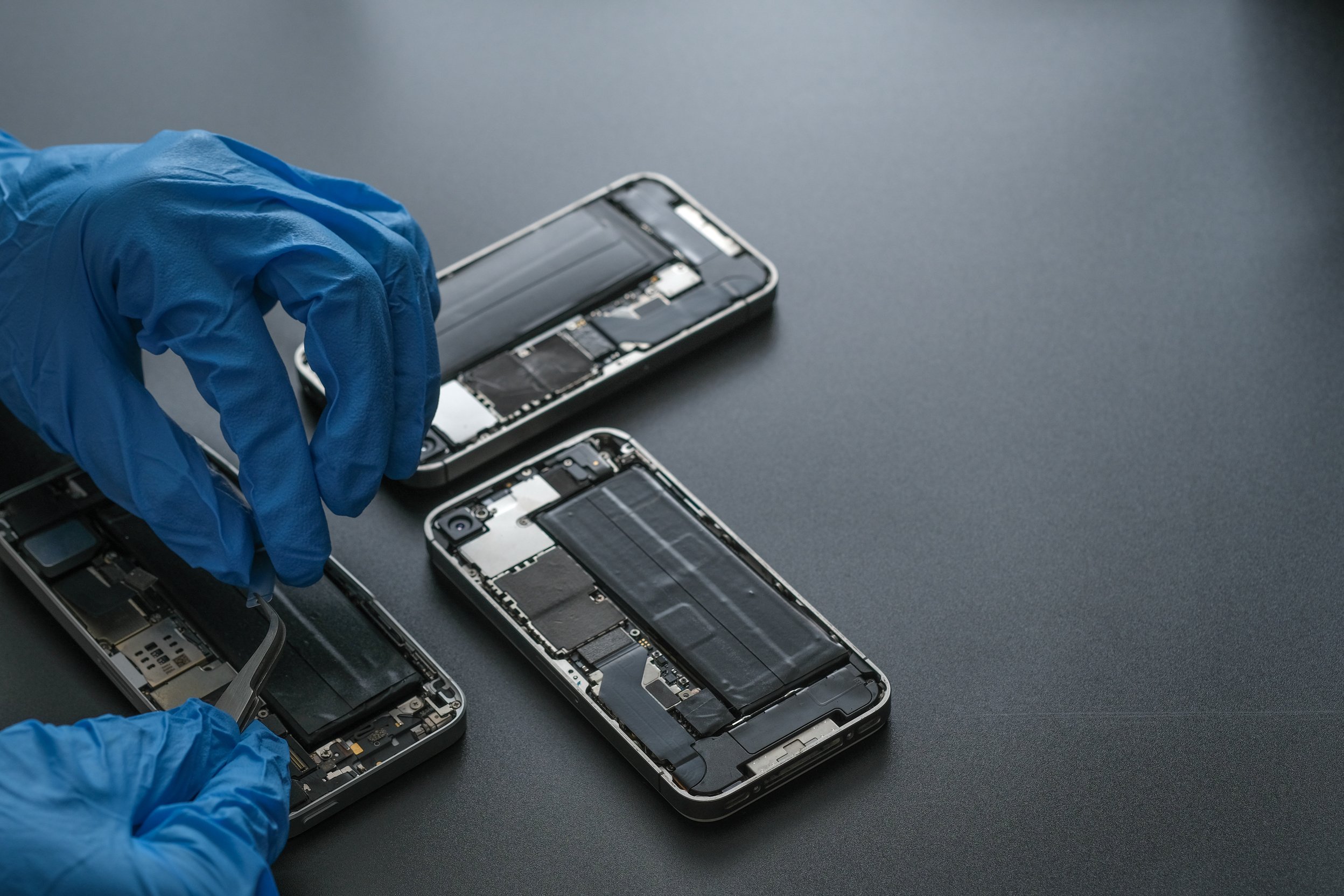 Technician repairing the Cell phone parts and tools for recovery repair phone smartphone